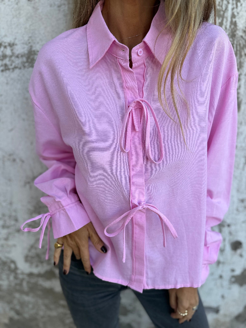 Blusa amarritas y botones escondidos rosada
