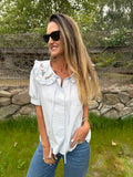 Blusa cuello bobo y flores celeste clara