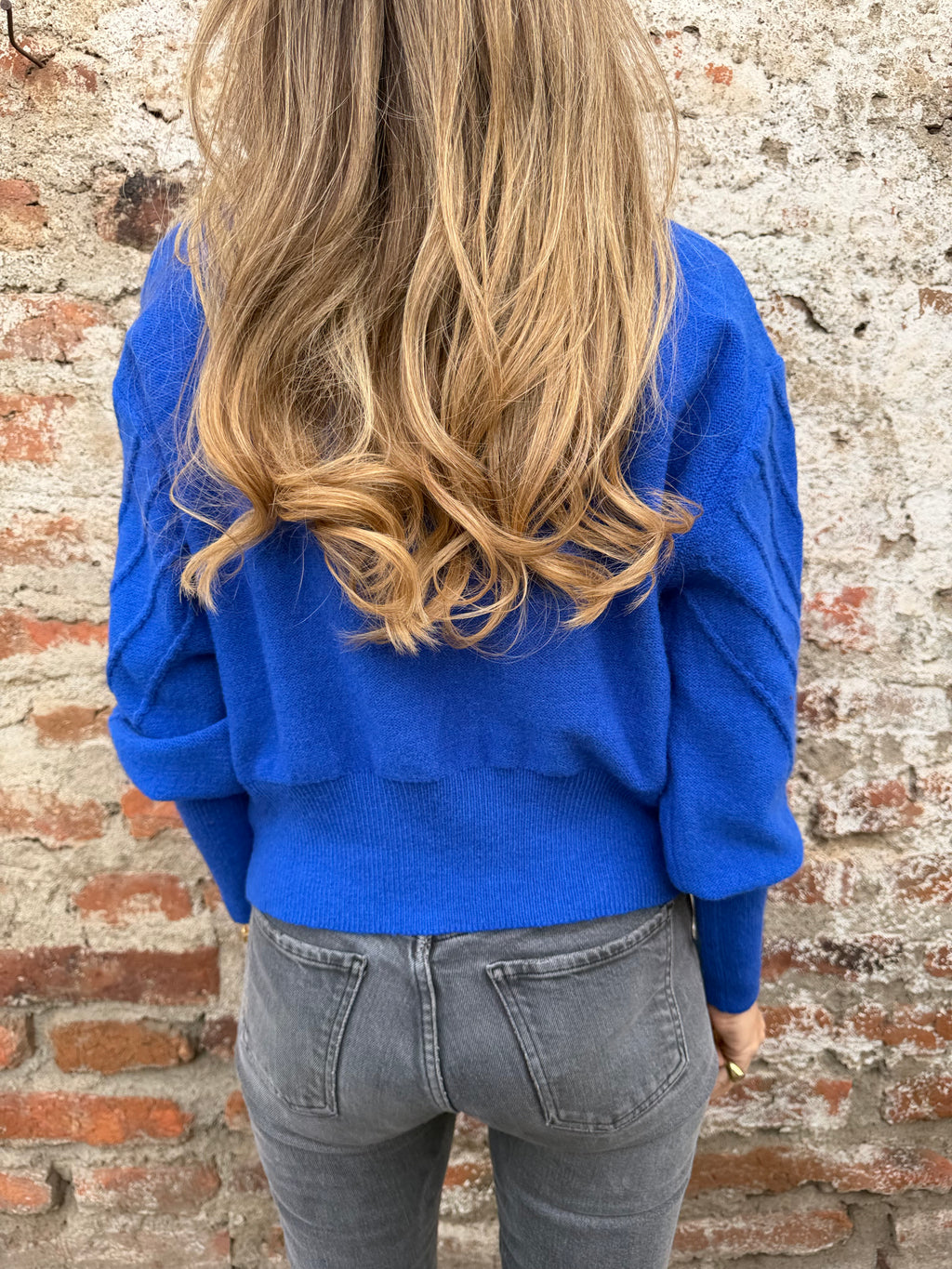 Chaleco mini pompón azulino