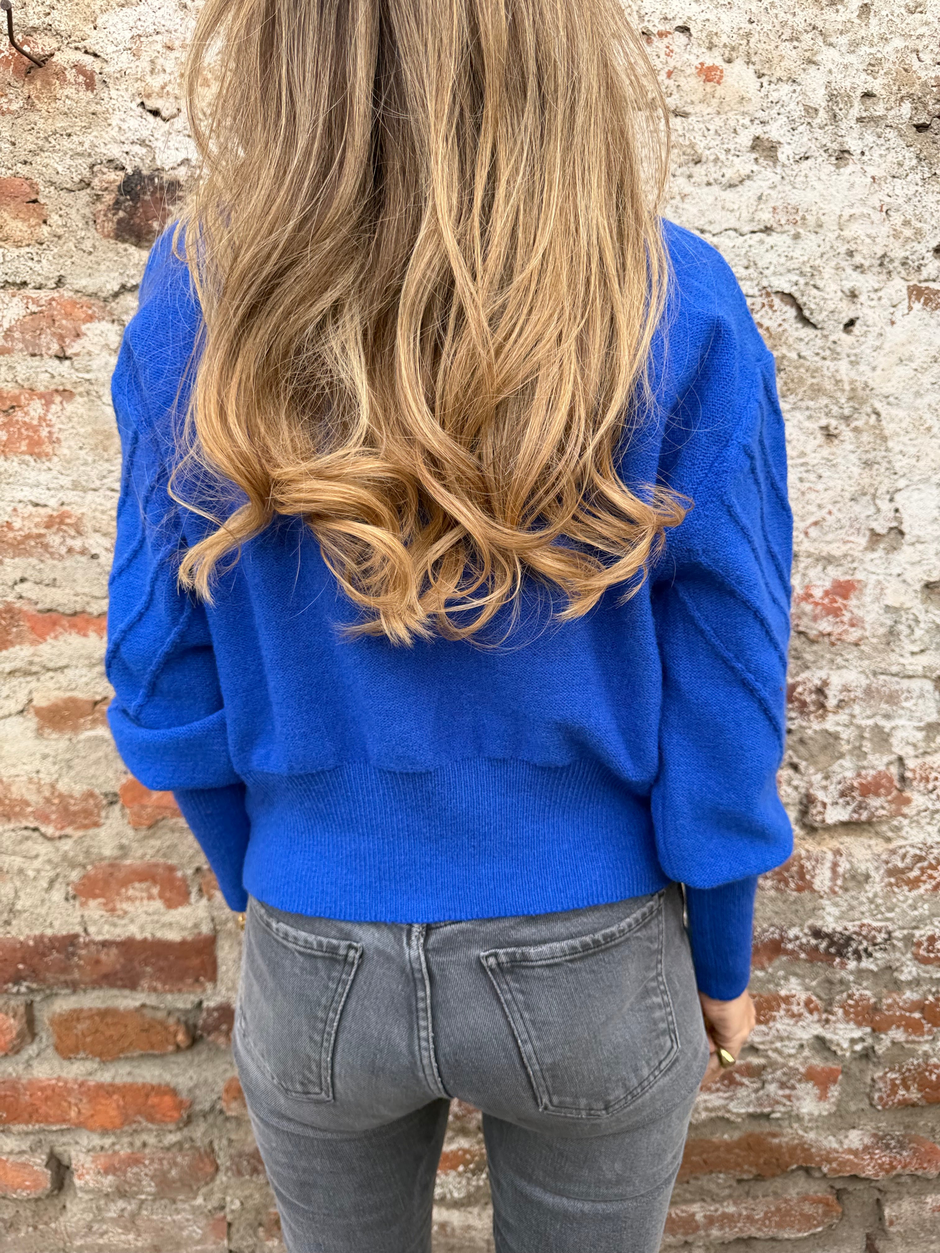 Chaleco mini pompón azulino