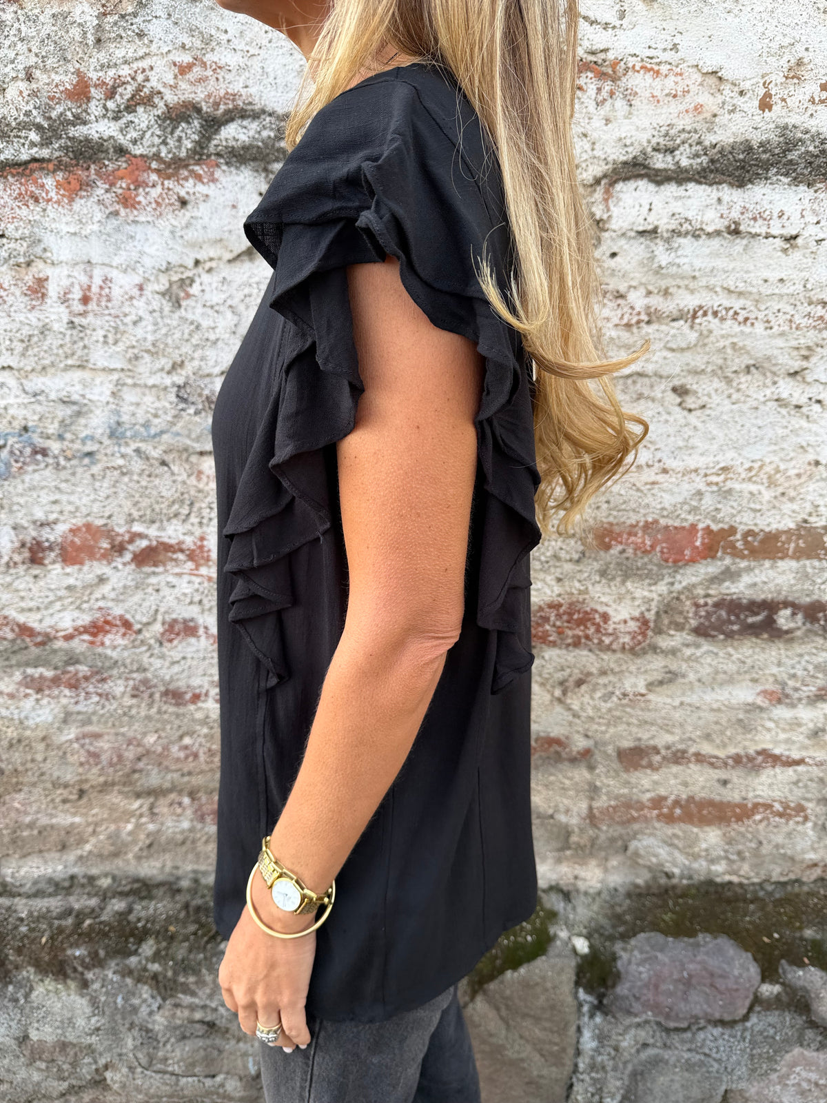 Blusa larga vuelitos laterales negra