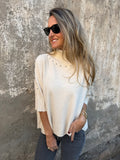 Chaleco medio cuello tachas crudo