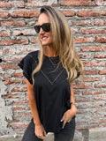 Polera tachitas negra