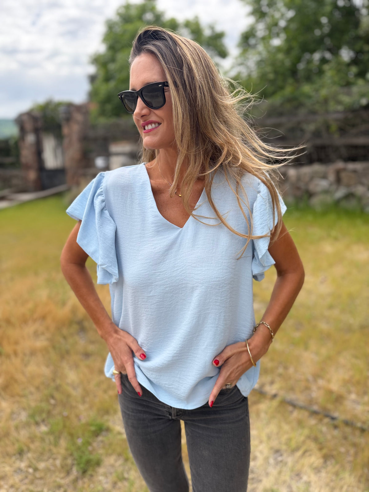 Blusa crep vuelitos mangas celeste