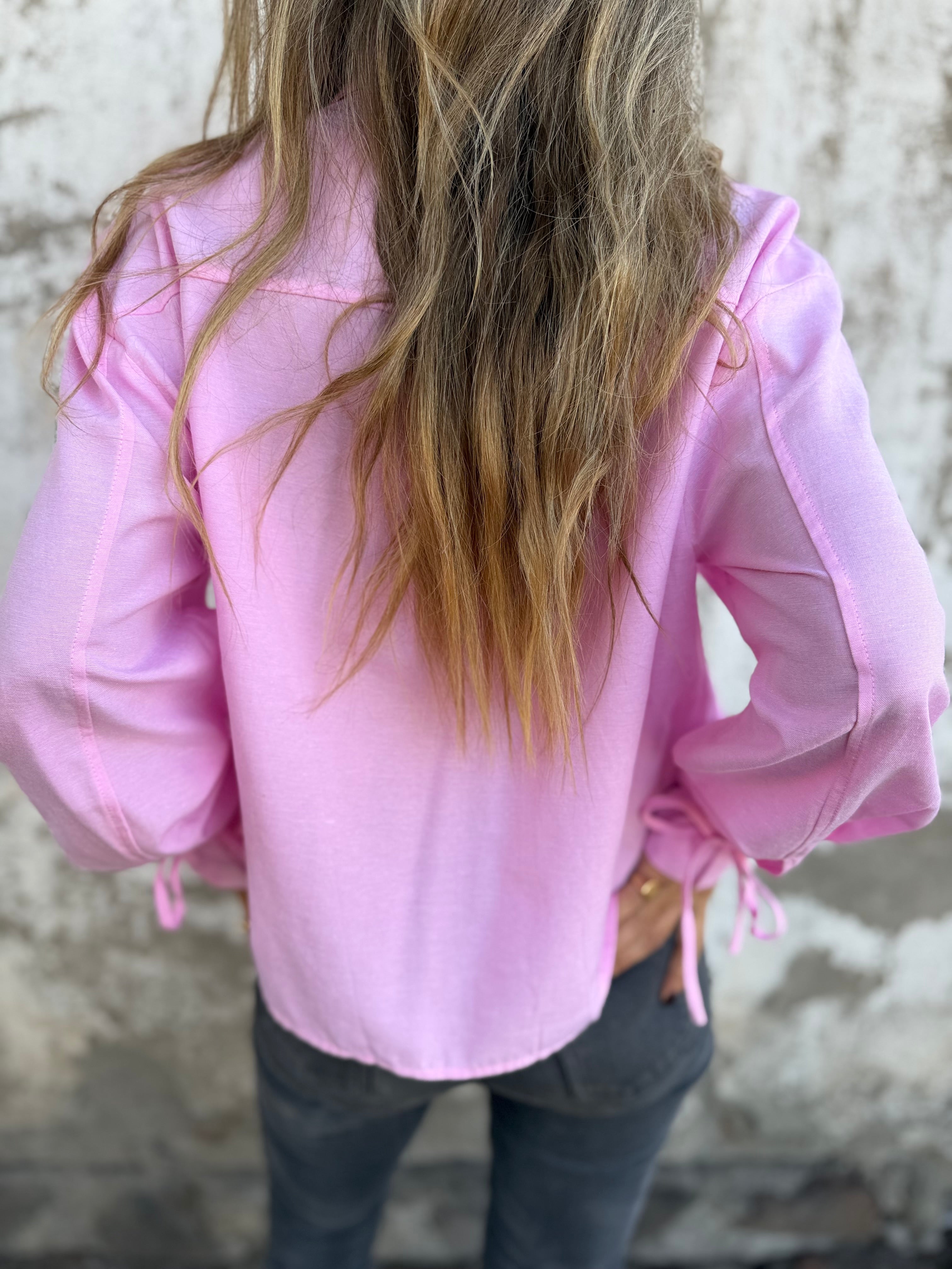 Blusa amarritas y botones escondidos rosada