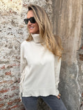 Cuello alto tiritas laterales crudo