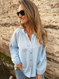 Blusa manga globo bordados celeste