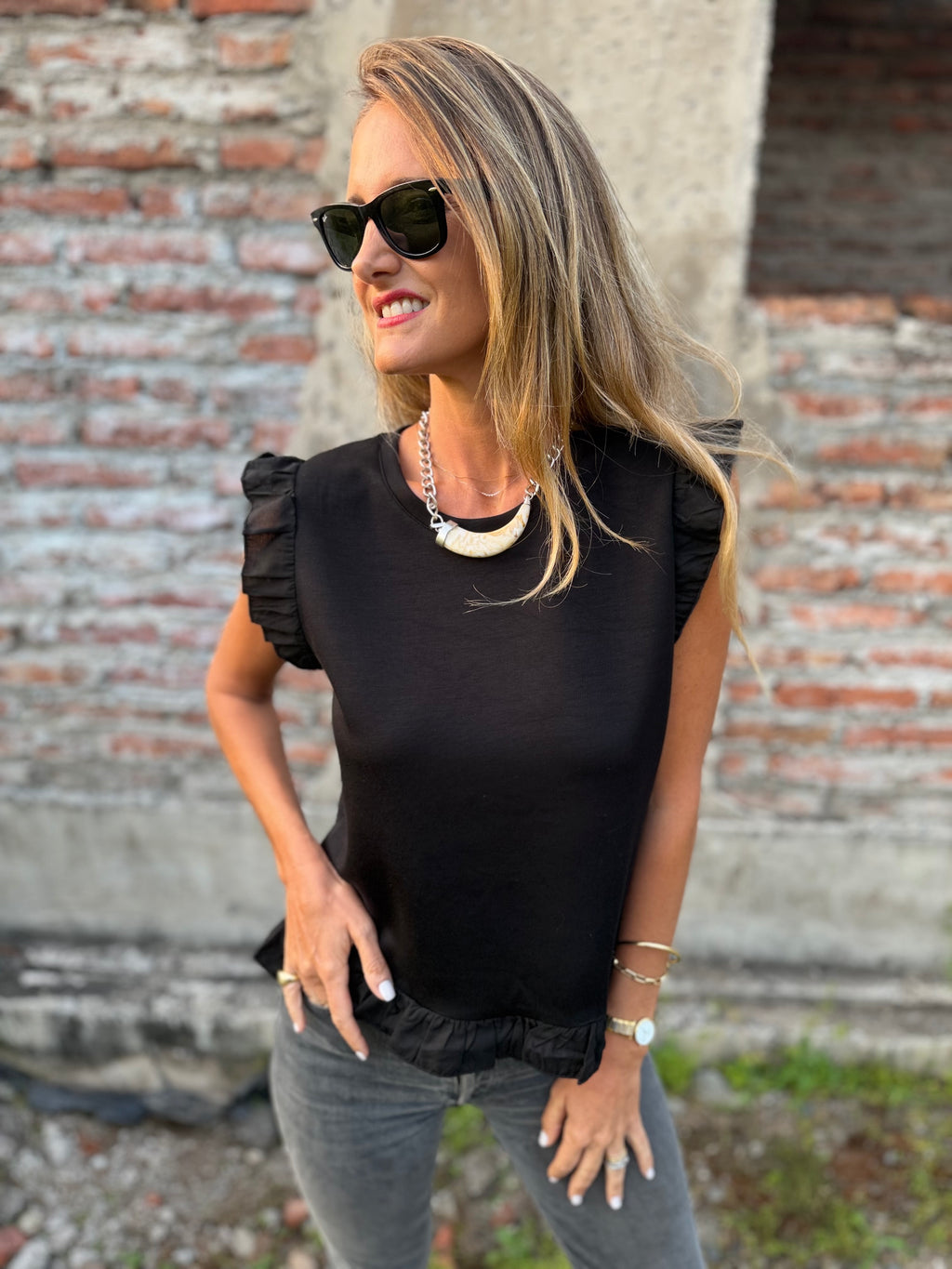 Polera vuelitos doble negro